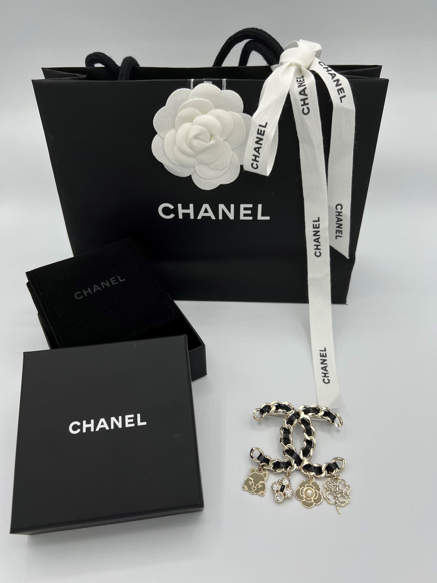Chanel Leather Woven Brooch with Charms