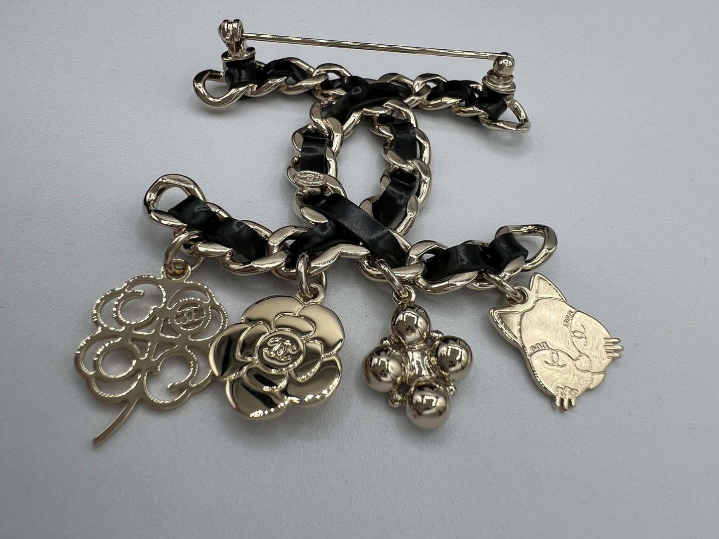 Chanel Leather Woven Brooch with Charms